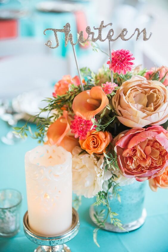 centerpiece and candles for 2019 summer coral wedding