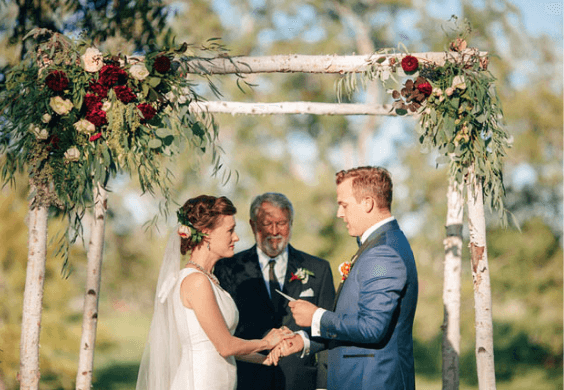 Wedding ceremony for navy, burgundy and gold wedding