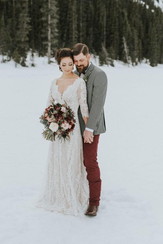 White bride and ring bearer for Burgundy, Grey and Gold Winter Wedding