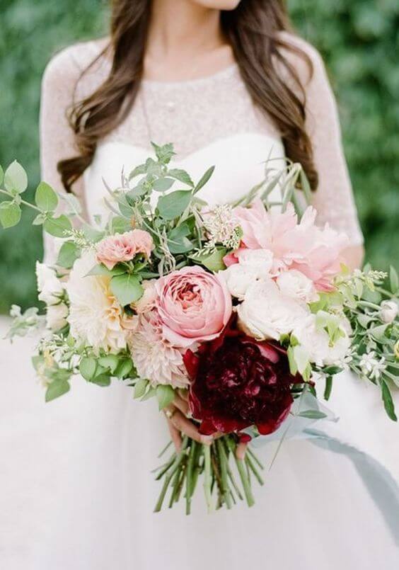 Bride with burgundy and blush bouquets for burgundy and blush wedding