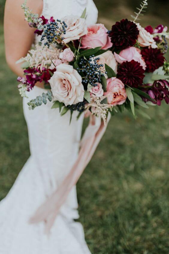 Bride with burgundy and blush bouquets for burgundy and blush wedding
