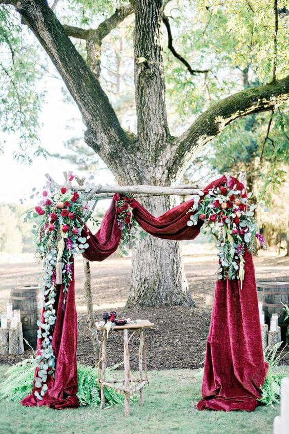 Wedding arch for burgundy and green wedding