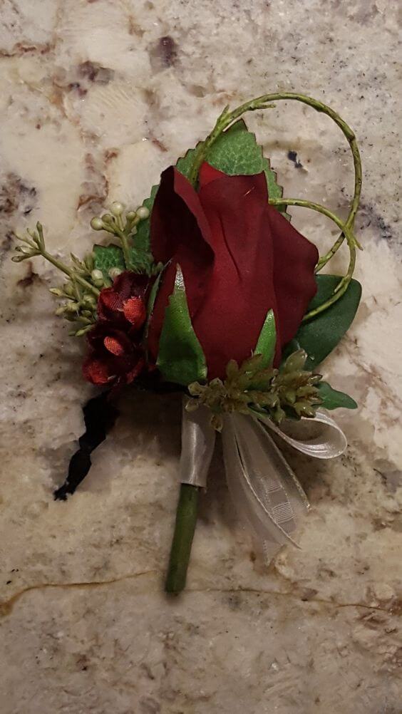 Wedding boutonniere for burgundy and green wedding