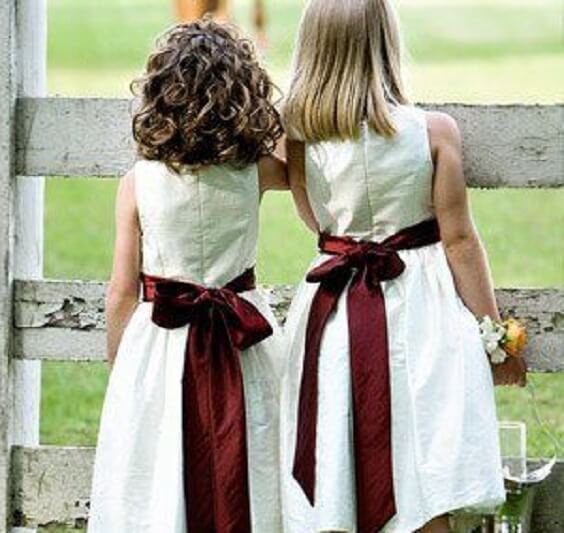 Flower girls for burgundy and ivory wedding