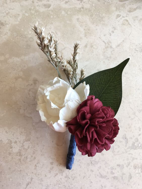 Wedding boutonniere for burgundy and ivory wedding