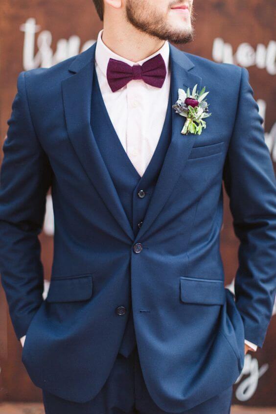 Groom with burgundy tie for burgundy and Navy wedding