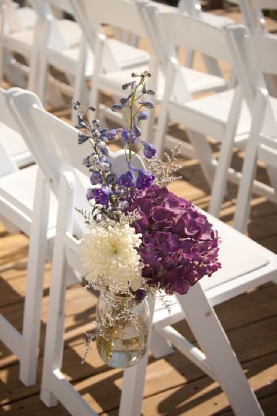 Wedding aisle arrangements for purple october wedding
