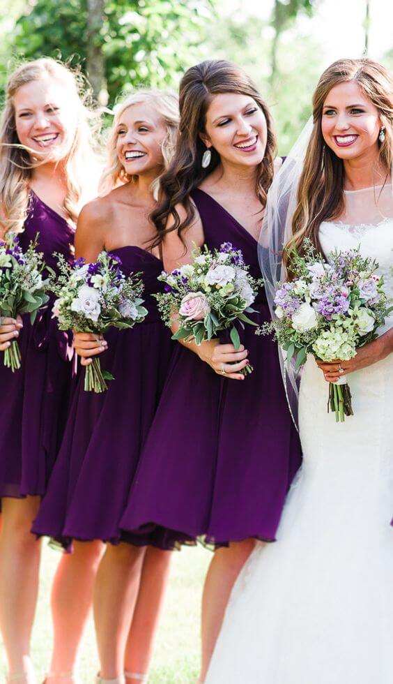 White bridal gown and purple bridesmaid dresses for purple october wedding