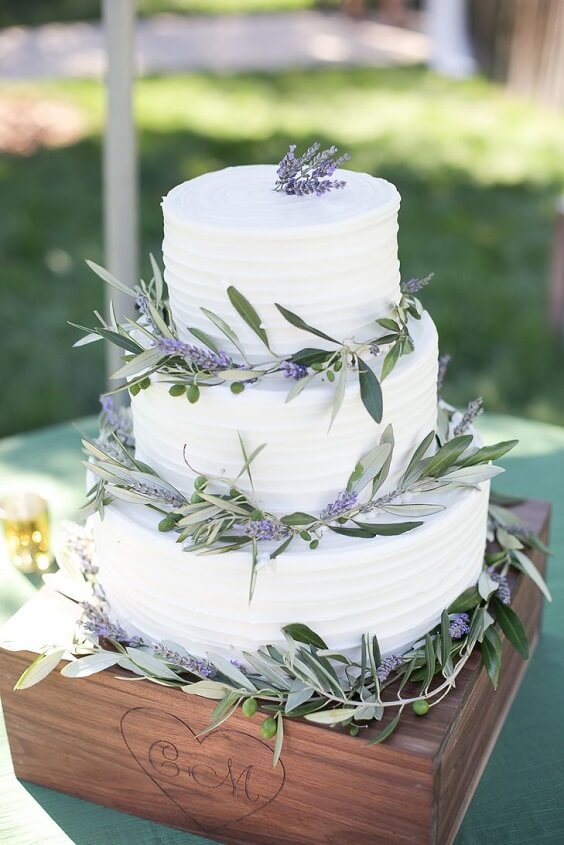 white wedding cake with greenery for summer wedding lavender bridesmaid dresses grey men's suits and centerpieces