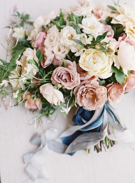 dusty rose and peach bouquet for summer blue wedding