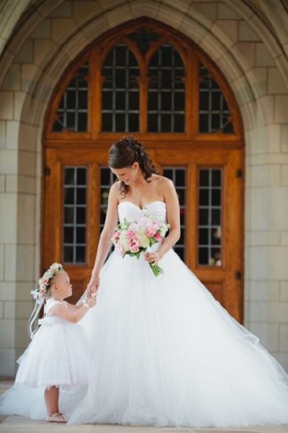 White bridal gown and white flower girl for Pink and Grey May Wedding