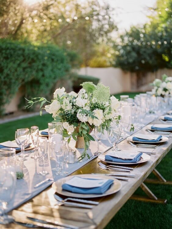 Table decorations for Dusty blue and greenery May Wedding