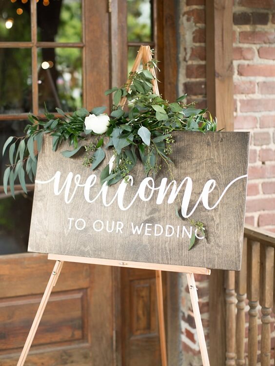 Welcome sign for Dusty blue and greenery May Wedding