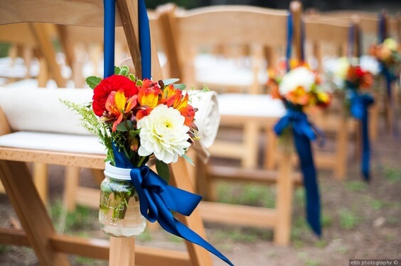 chairs and decorations for july royal blue and orange wedding 2019