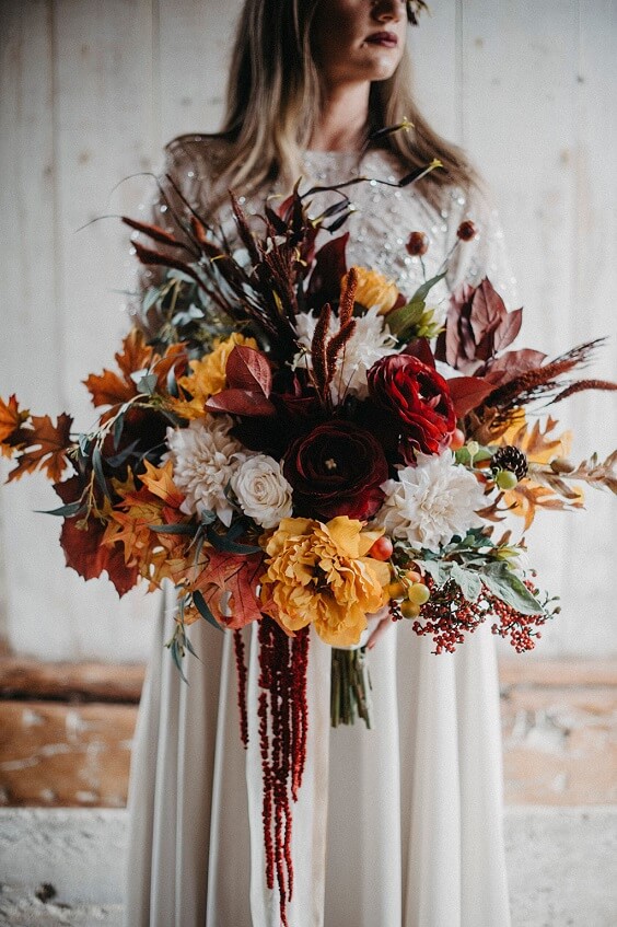 October Wedding-Rust Bridesmaid Dresses Paired with Orange Bouquets and