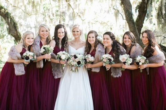 blush wedding dress with burgundy bridesmaids