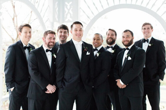 Groom and groomsmen suits for dark red and pink winter wedding
