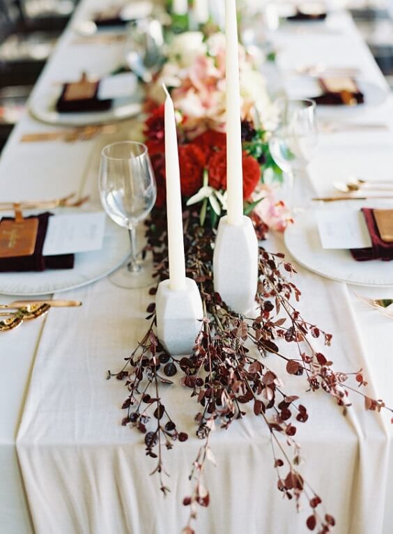 Table decorations for dark red and pink winter wedding