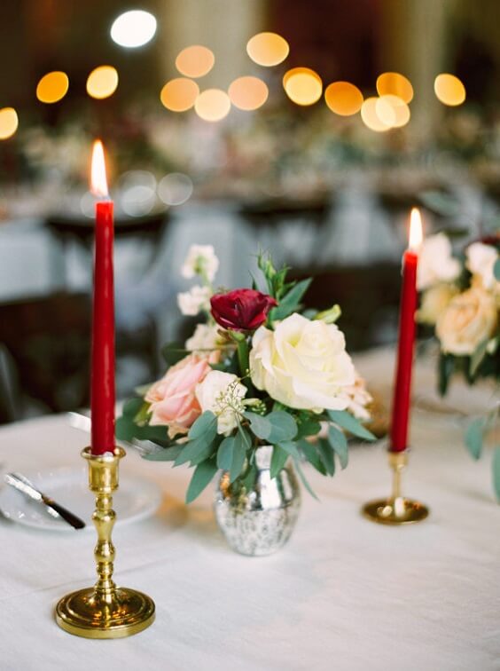 Table decorations for dark red and pink winter wedding