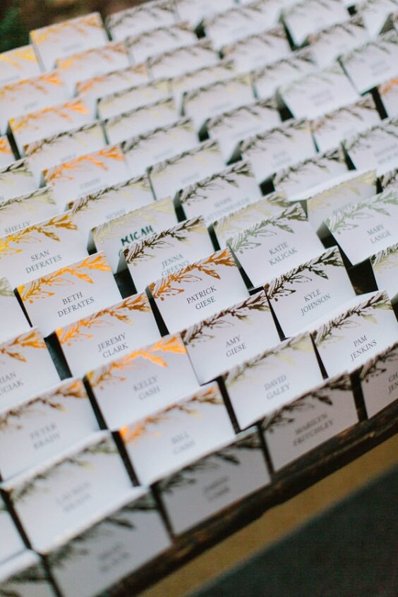 Place cards for champagne and burgundy winter wedding