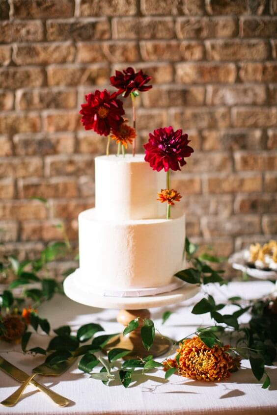 wedding cake for champagne and burgundy winter wedding