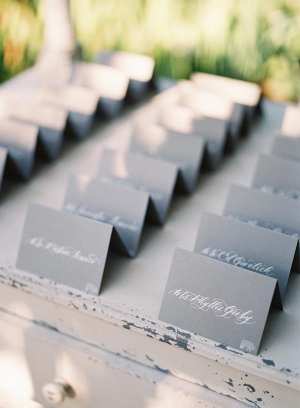 Place cards for dusty blue and blush summer wedding