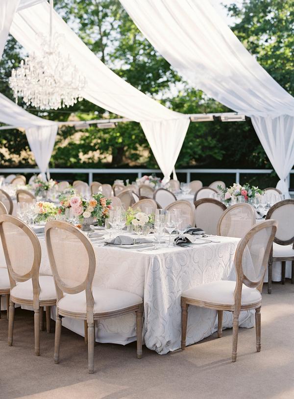 Table decorations for dusty blue and blush summer wedding