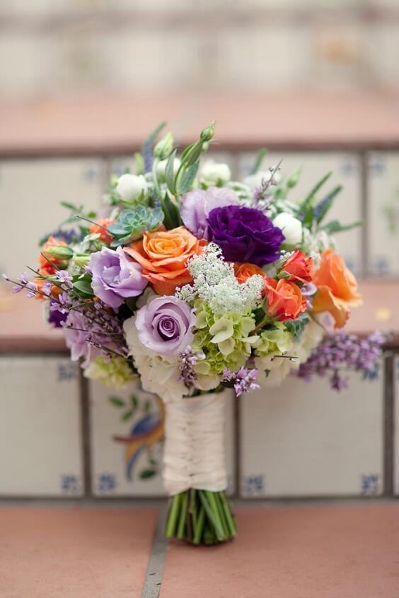 Bridal bouquets for purple and persimmon winter wedding