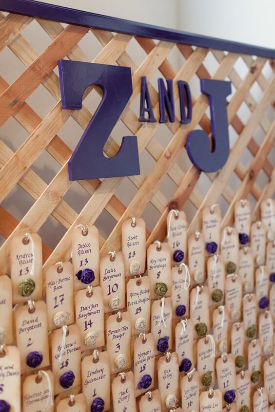 Seating cards for purple and persimmon winter wedding