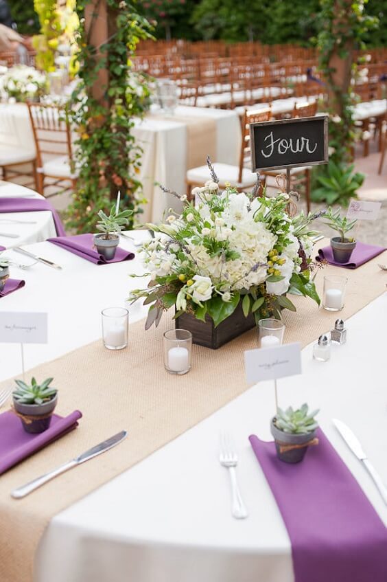 Table decorations for purple and persimmon winter wedding