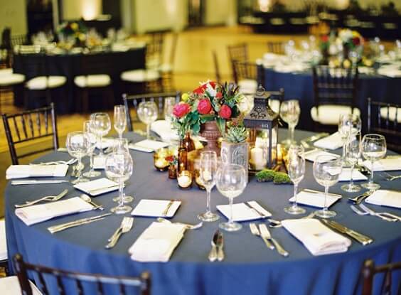 Table decorations for navy blue and burgundy winter wedding