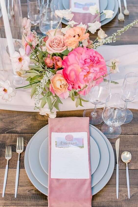 Table decorations for silver and fuchsia March wedding