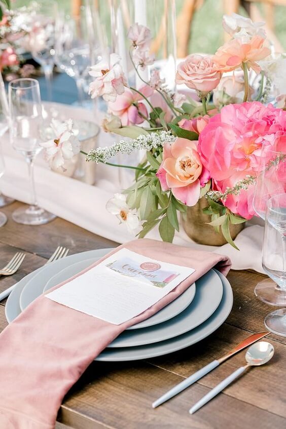 Table decorations for silver and fuchsia March wedding