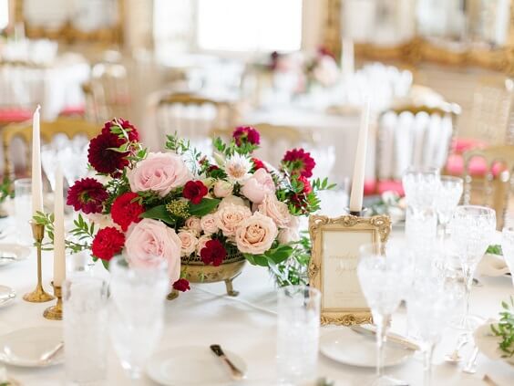 Table decorations for blush and burgundy March wedding