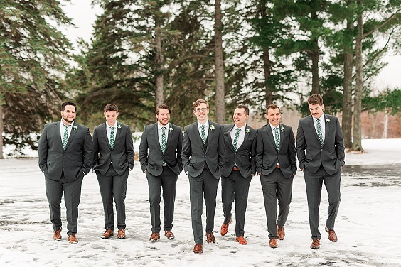 men in black suits and emerald green ties for february wedding colors 2022 emerald green gold and black colors