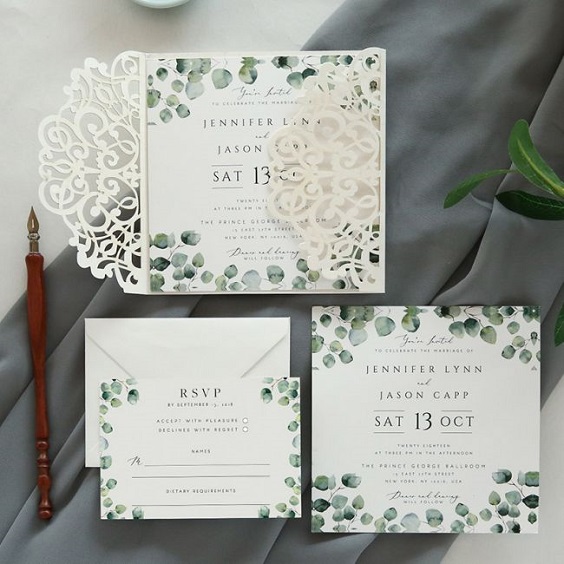 white invitation with green accent for march wedding colors 2022 grey and greenery