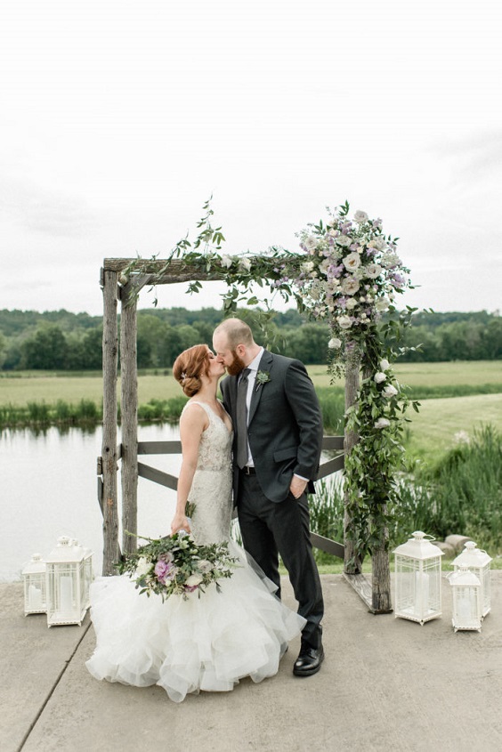 lavender and greenery floral on wedding arch and bouquets for April wedding colors 2022 light pink pale yellow and gold colors