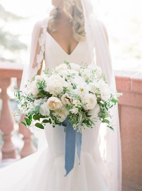 white bridal gown white bouquets with blue ribbons for April wedding colors 2022 white and blue colors