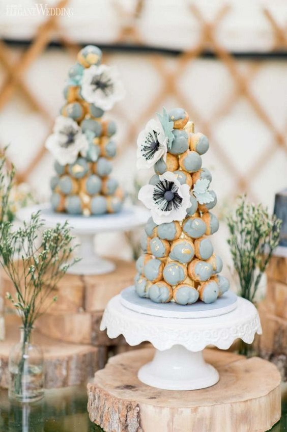 croquembouche towers with splashes of dusty blue for june wedding colors 2022 dusty blue and yellow