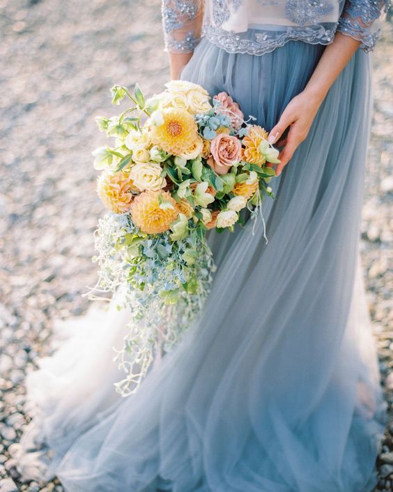 dusty blue dress and yellow bouquet for june wedding colors 2022 dusty blue and yellow