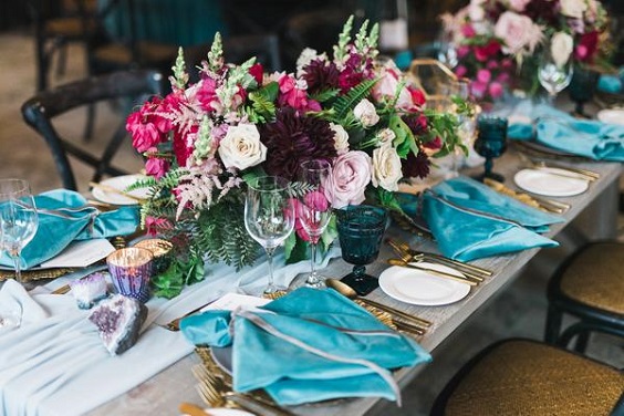 raspberry centerpieces and blue napkins for june wedding colors 2022 raspberry and blue