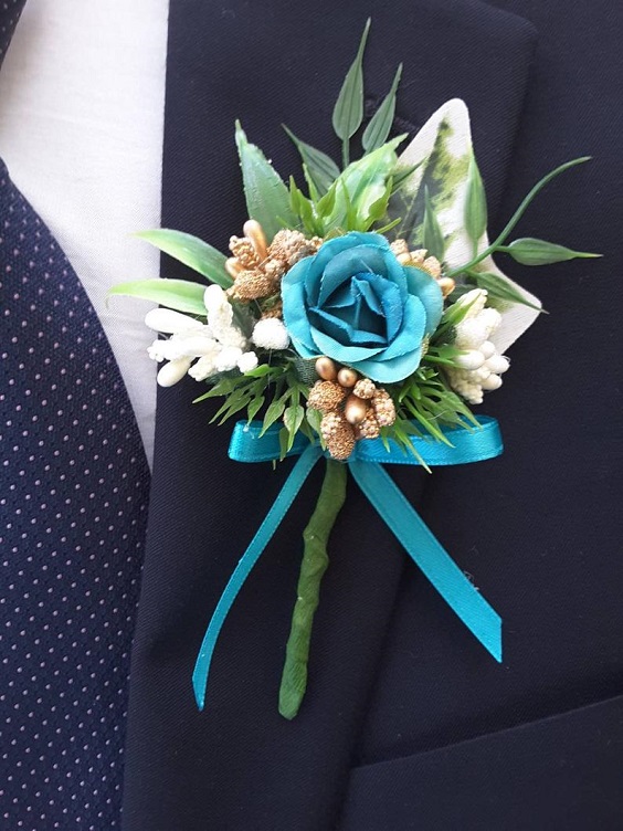 mens suit with teal boutonniere for june wedding colors 2022 teal and gold