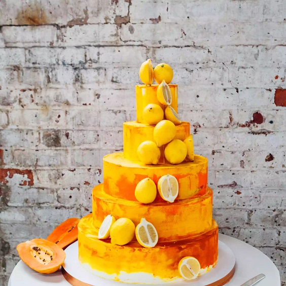 tangerine and yellow wedding cake for summer wedding color 2022 tangerine yellow and fuschia