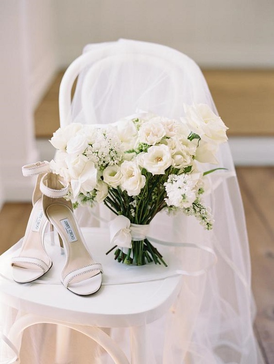 white wedding shoes and white bouquets for summer wedding color 2022 light blue and white