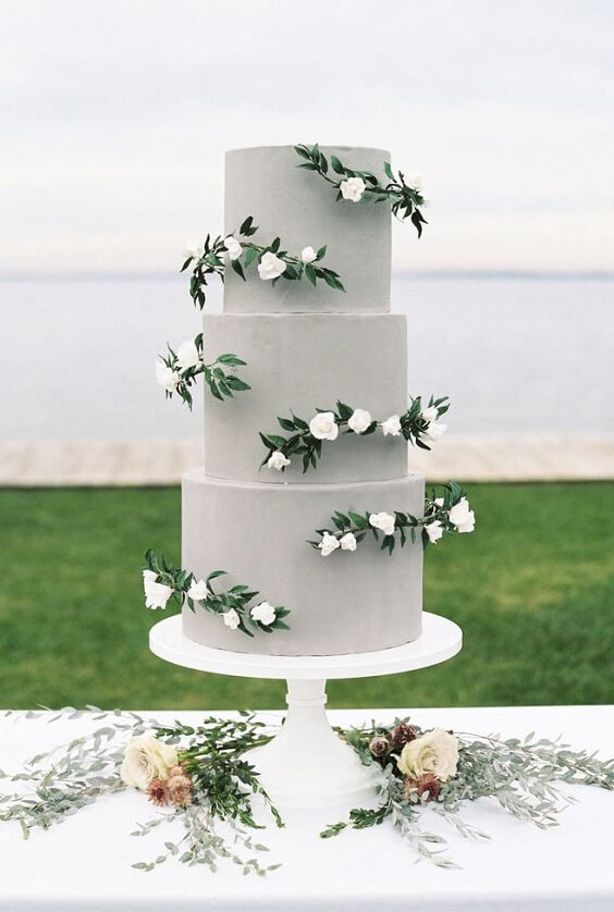sage green wedding cake with white flowers for winter wedding colors 2022 sage green and burgundy