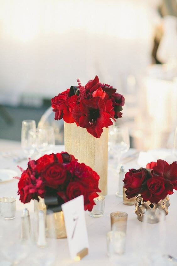red flowers and gold wedding table setting for winter wedding colors 2022 red and gold