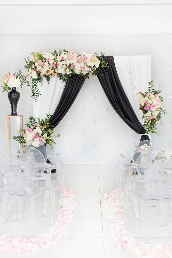 wedding arch with black cloth pink and white flower decoration for spring wedding colors 2022 black white pink colors