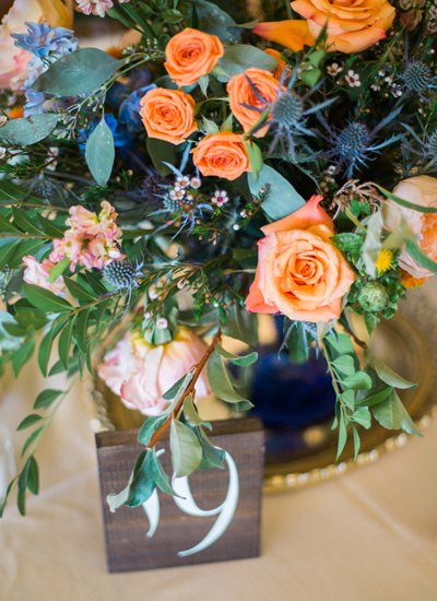 centerpieces and table number for august wedding colors 2022 blue and orange