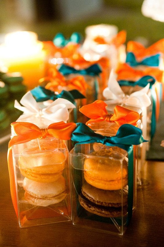 wedding macroon in boxes with teal and orange ribbons for fall wedding colors 2023 teal and orange