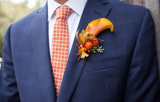 navy blue groom suit burnt orange tie and boutonniere for fall wedding colors 2023 navy and burnt orange